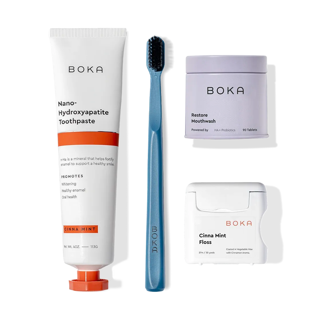 Advanced Kit: toothpaste safe for kids if ingested, toothbrush, and floss on a white background.