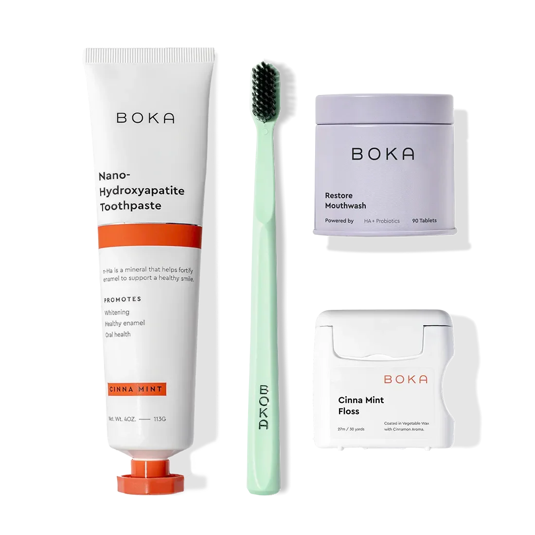 Advanced Kit: Boka toothpaste (safe if ingested), toothbrush, floss, and mouthwash tablets on white.