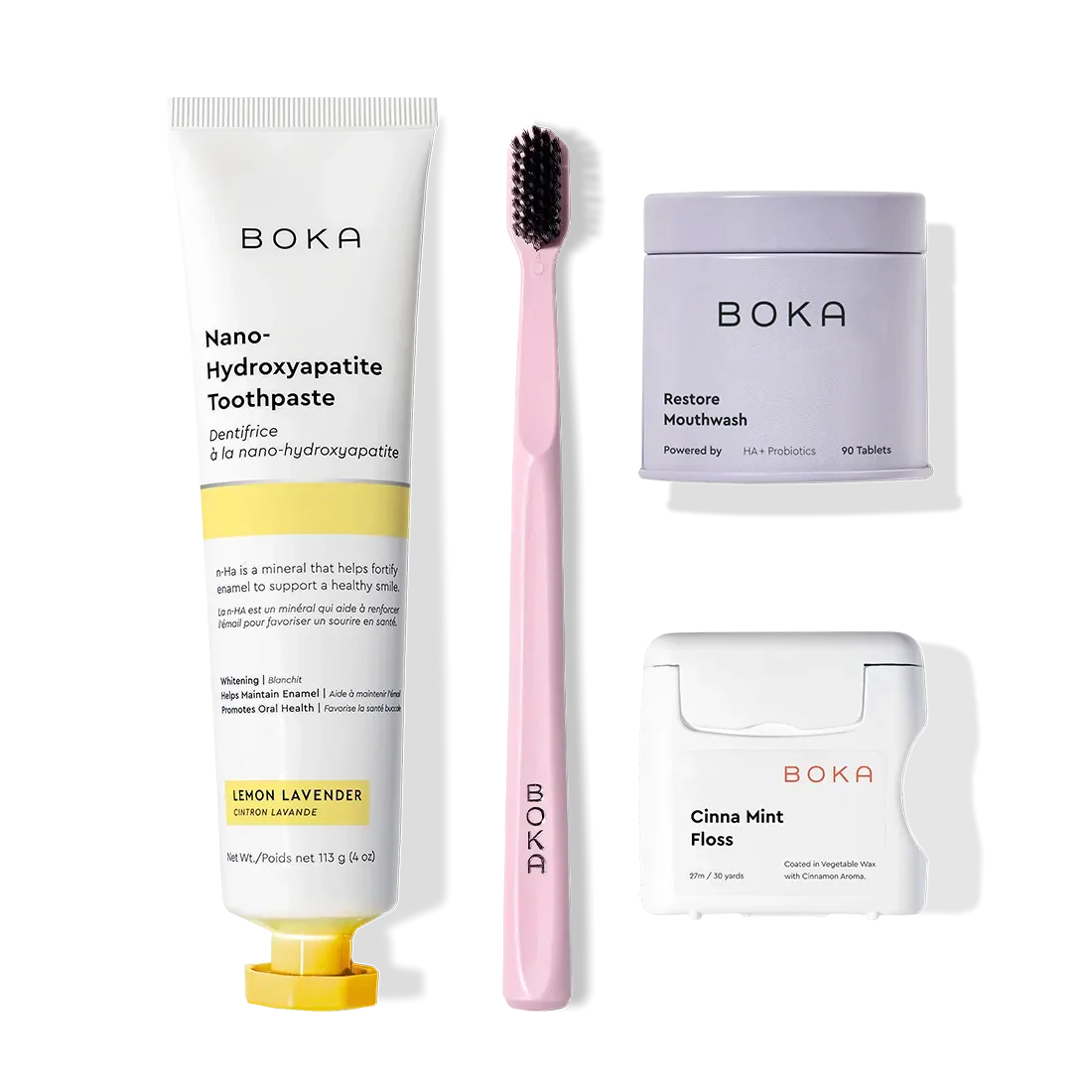 Boka Advanced Kit—kid-safe toothpaste, pink brush, floss, mouthwash tabs on white background.