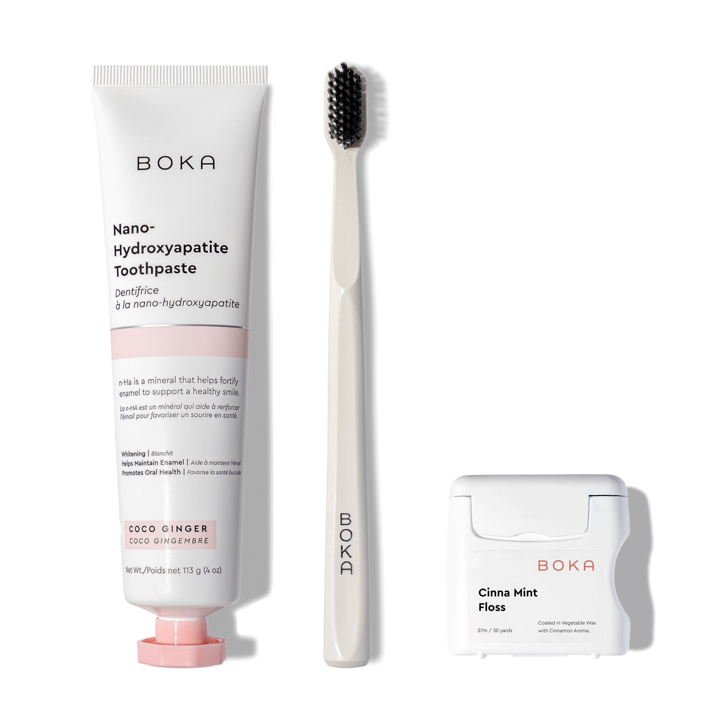 Classic Kit: toothpaste, teflon-free floss, and charcoal bristle brush on white background.