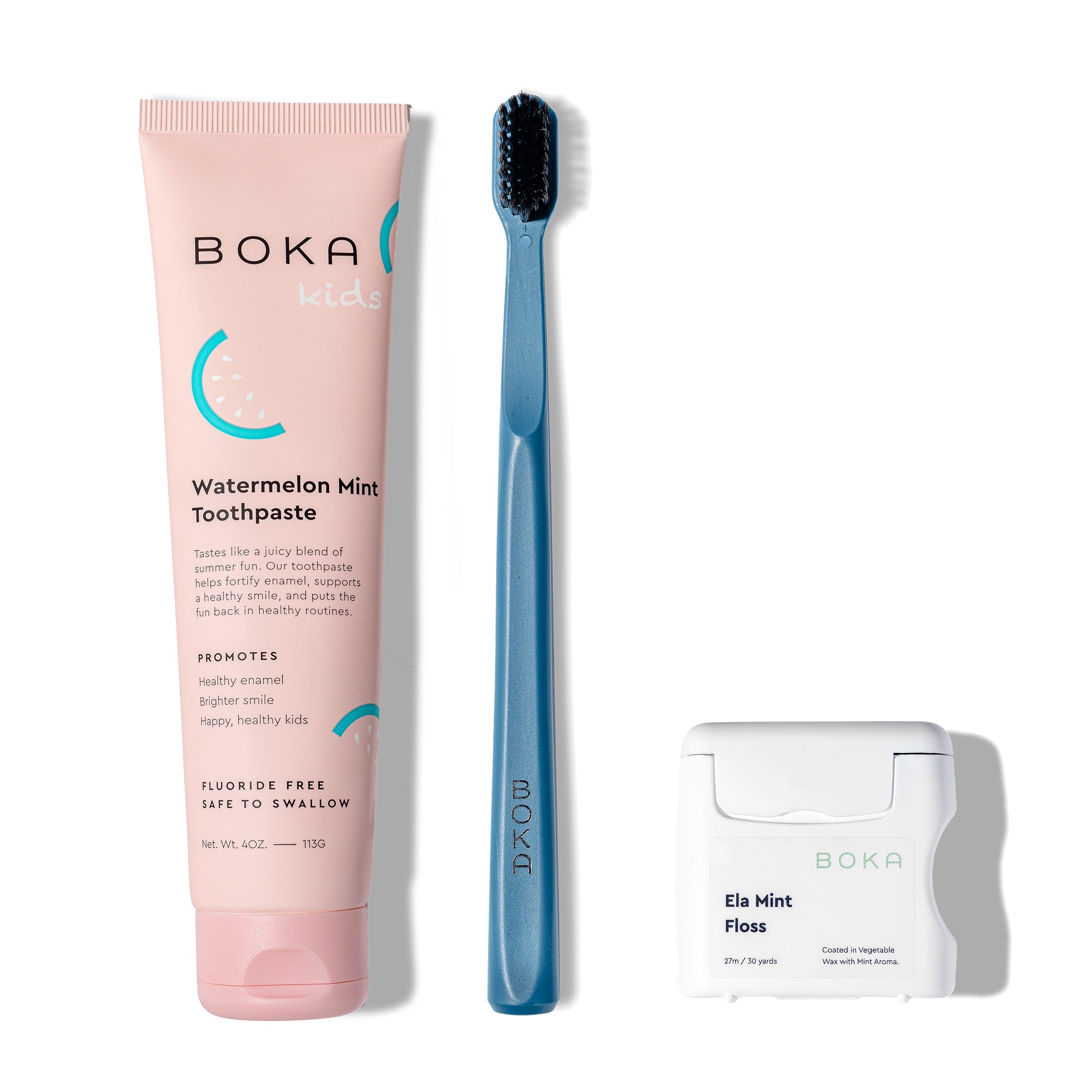 Classic Kit: pink nano-hydroxyapatite toothpaste, blue charcoal toothbrush, teflon-free floss on white.