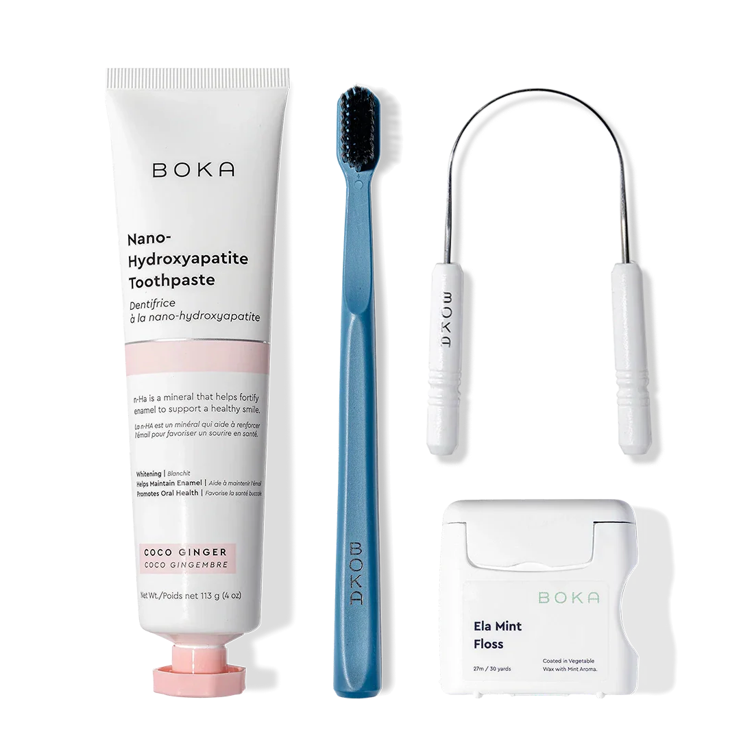 Starter Kit: toothpaste, blue charcoal toothbrush, tongue cleaner & mint floss on white background.