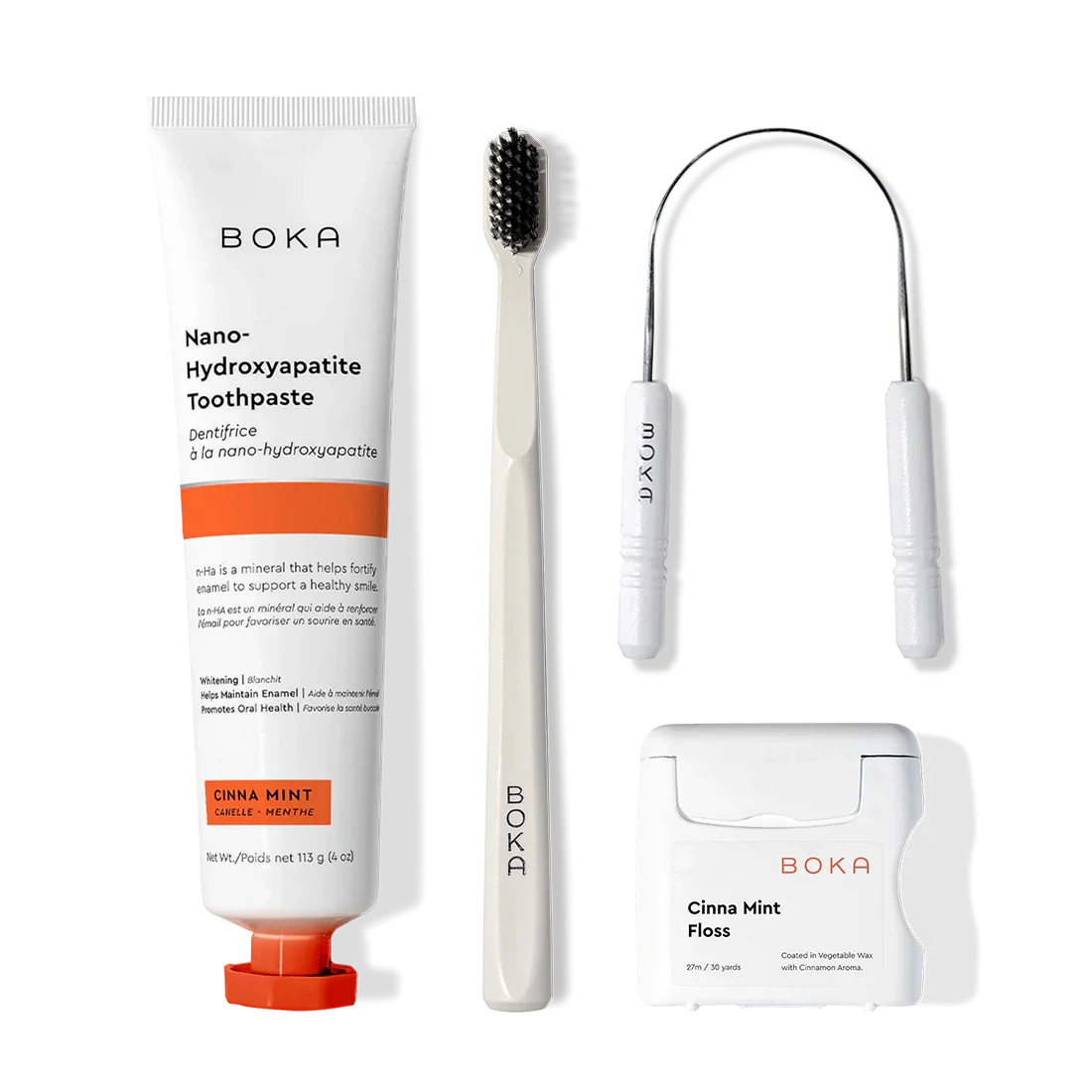 Starter Kit with nano-hydroxyapatite toothpaste, toothbrush, floss & tongue cleaner on white background.