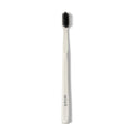 Classic Toothbrush with activated charcoal bristles; BOKA logo printed on white handle.