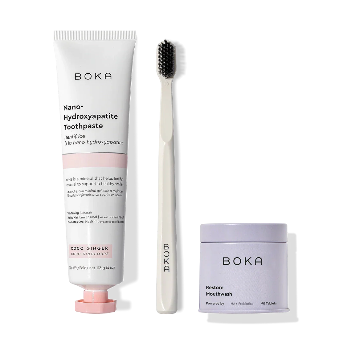 Fresh Faced toothpaste, probiotics, and charcoal bristles displayed upright on a white background.