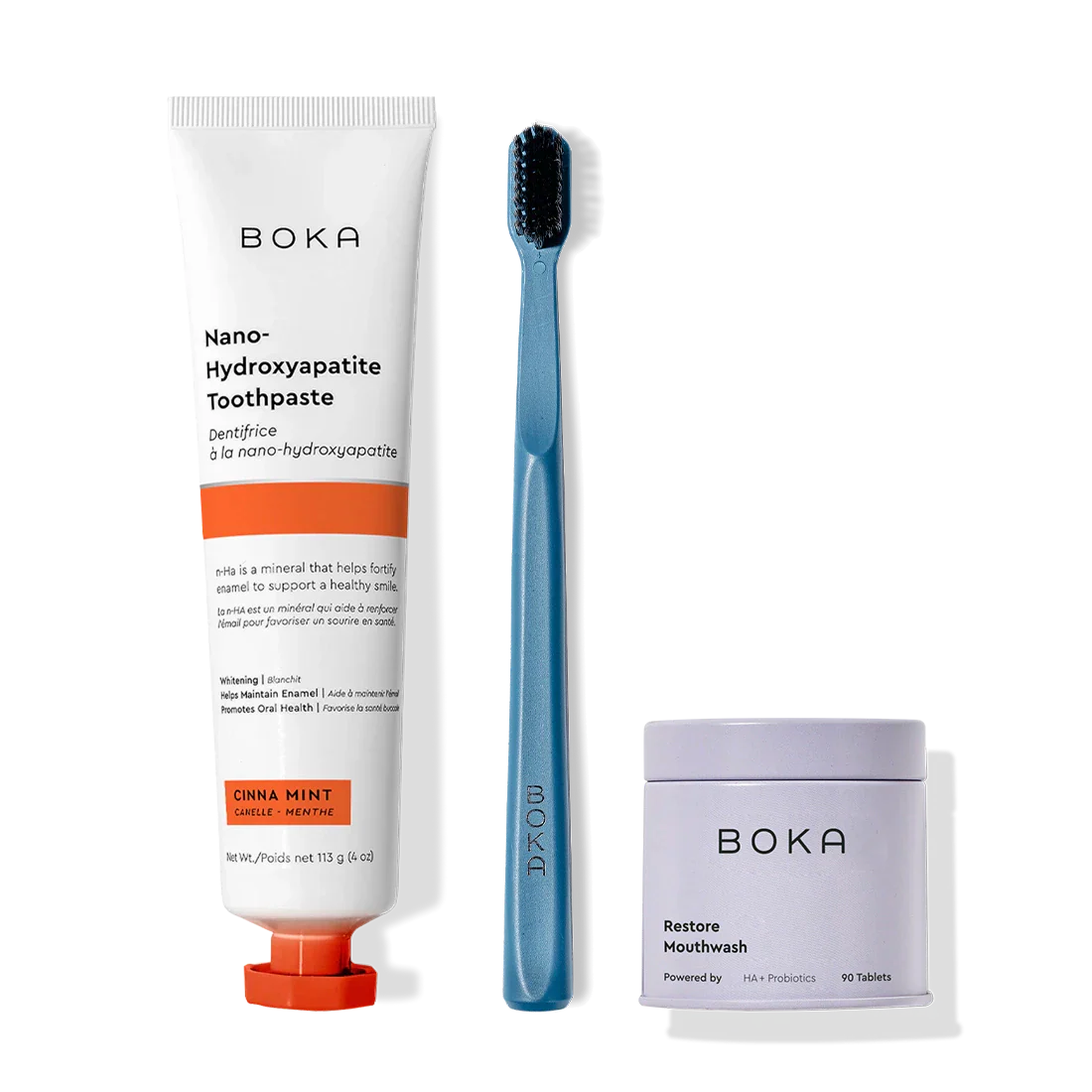 Fresh Faced toothpaste, blue charcoal-bristle toothbrush, and mouthwash tablets on white.