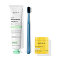 Fresh Faced toothpaste, blue charcoal-bristle toothbrush, and yellow Restore Mouthwash bottle.
