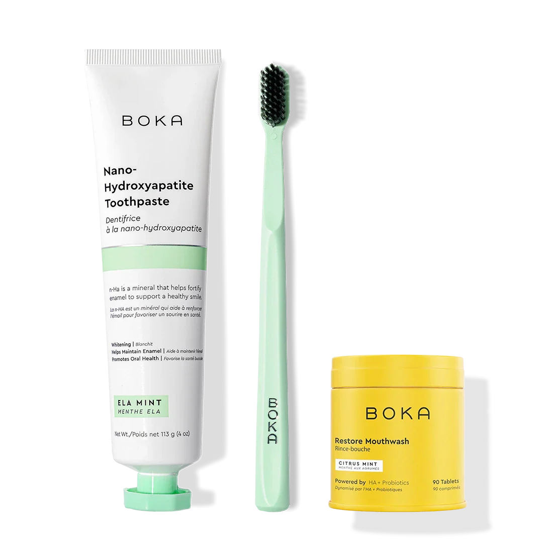 Fresh Faced toothpaste, charcoal toothbrush, and mouthwash tablets on a white background.