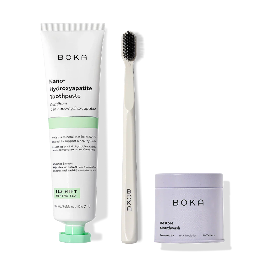 Fresh Faced toothpaste, black activated-charcoal toothbrush, and Restore tablets shown.