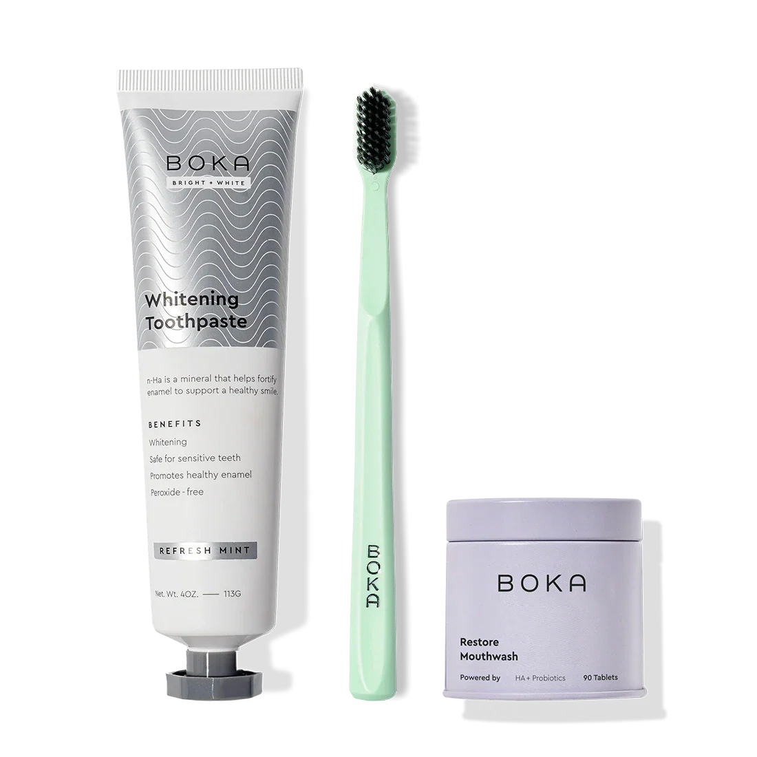 Fresh Faced toothpaste, a green activated charcoal toothbrush, and Restore Mouthwash tablets.