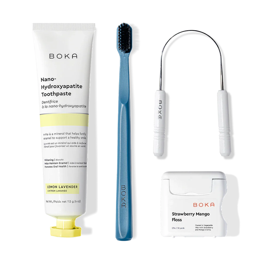 Boka Starter Kit with nano-hydroxyapatite toothpaste, charcoal toothbrush, floss & holder on white.