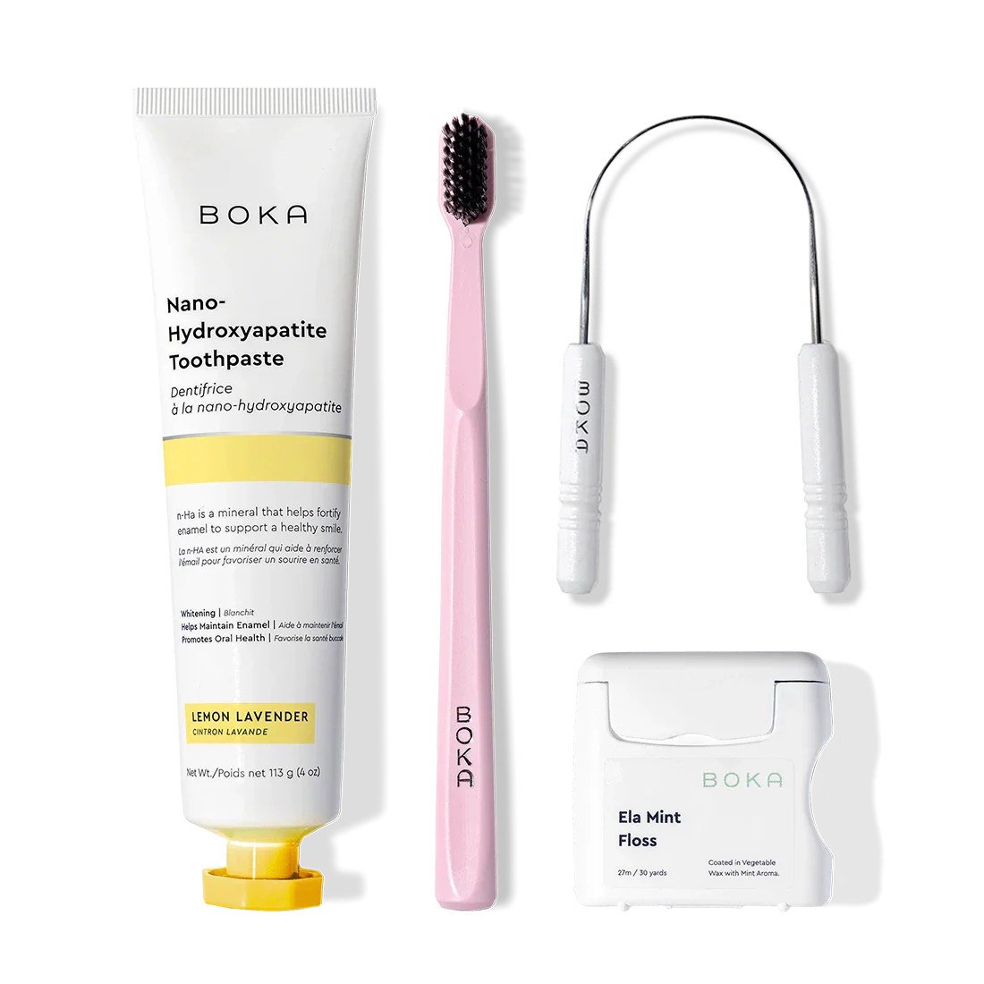 Boka Starter Kit: nano-hydroxyapatite toothpaste, pink toothbrush, tongue cleaner, and floss.