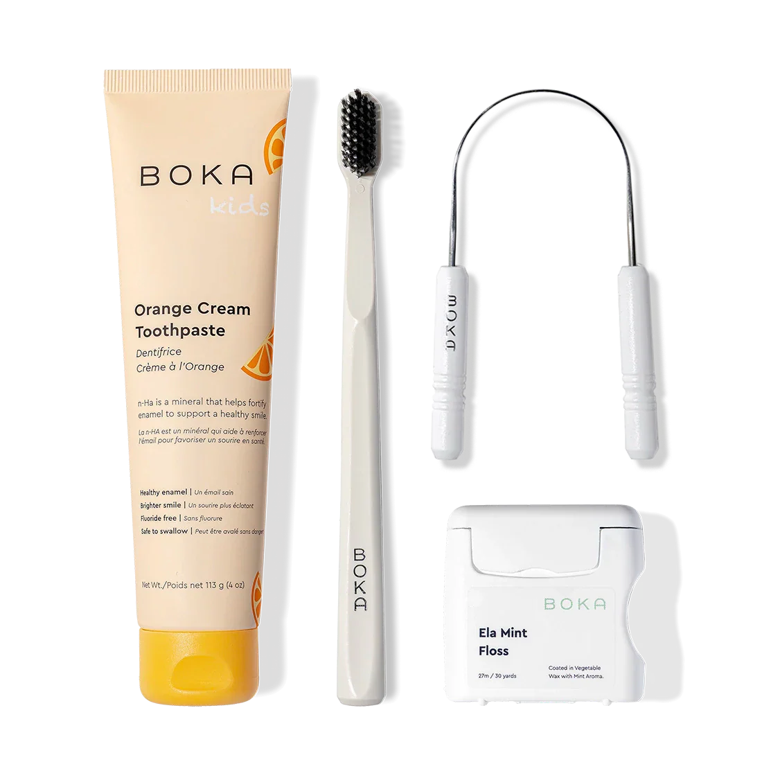 Boka Starter Kit: nano-hydroxyapatite toothpaste, charcoal toothbrush, and mint floss on white.
