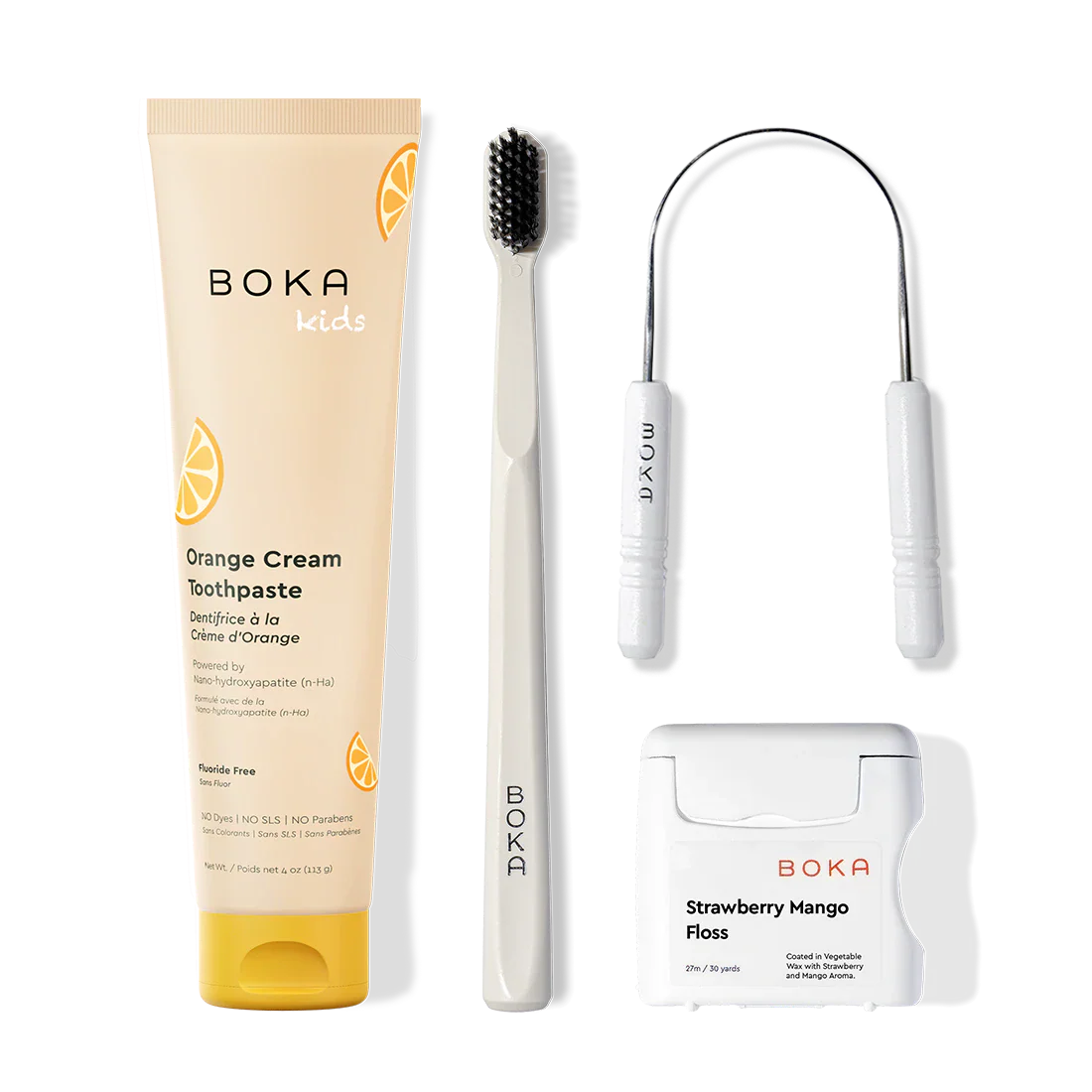 Boka dental care products including toothpaste, toothbrush, Tongue Scraper and floss on a white background