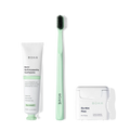 The Travel Kit, featuring Boka toothpaste, charcoal bristle brush, and floss on display.